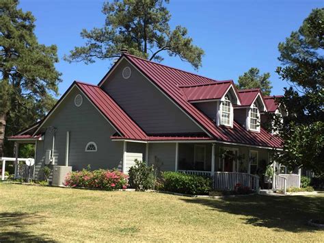 houses with red metal roofs|colonial red roof.